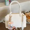 Bolso de mujer de alta gama de nicho 2026 nueva versión coreana bolso de hombro cruzado simple y elegante bolso de mano de gran capacidad moderno
