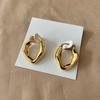 Pendientes de textura irregular con diseño de nicho europeo y americano, grandes y elegantes pendientes chapados en oro, ligeros y lujosos, con hebilla de oreja de moda para mujer.