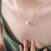 Collar con colgante redondo de piedra natural de diseño nicho versátil, personalidad elegante y hermosa de estilo francés nuevo, joyería de lujo ligero para mujer