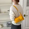 Bolso de trabajo estilo coreano con bolsillo en la axila para mujer, principios de otoño de 2026, hebilla de cinturón vintage, bolso de hombro cruzado simple y elegante