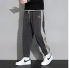 Pantalones casuales de pana para hombre Otoño e Invierno con forro polar Engrosados Holgados Deportivos Marca de Moda Elásticos Juveniles Pantalones Largos