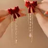 Brincos de Pérola com Laço Vermelho para Outono e Inverno Brincos de Luxo Femininos 2025 Novo Estilo Chinês Brincos Vermelhos