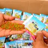 Um ninho de iscas de pesca Isca de painço Peixe painço Pesca selvagem em poços pretos Carpa Crucian Carp Arroz com vinho Isca de fundo Aroma medicinal de três cores Painço
