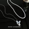 Collar de perlas de doble capa con forma de mariposa de cristal azul, nuevo estilo, cadena de clavícula superpuesta, collar ligero de lujo con diseño de nicho.
