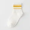 Calcetines nuevos otoño e invierno tres rayas calcetines deportivos rayados calcetines para mujer boca dorada y plateada calcetines de algodón hasta la mitad de la pantorrilla para mujer al por mayor
