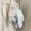 Bolso Orejas de Conejo de Moda 2026 Nuevo Modelo Rayas Verticales Mochila de Lona de Gran Capacidad para Viajes Cotidianos Mochila Versátil con Bloques de Color