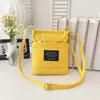 Bolso bandolera pequeño cuadrado de lona con bloques de color, moderno y versátil, para mujer, para teléfono móvil y monedas, portátil para el día a día, venta al por mayor