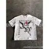 2026 Nueva Camiseta Negra de Moda con Estampado de Ángel Oscuro Estilo Callejero Versátil Casual Holgada Cuello Redondo Manga Corta