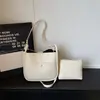 Bolso cruzado casual de diseño de nicho de moda transfronterizo, patrón simple de lichi, bolso de alta gama para madre e hija para ir al trabajo, bolso cruzado versátil