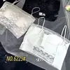 Nuevo sujetador de una pieza de encaje sin espalda con tirantes finos para primavera y verano, sujetador tipo top de encaje con copa fija para mujer