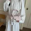 Bolsa feminina de nicho 2026, nova bolsa transversal mini casual requintada, bolsa cilíndrica estilosa de mão