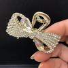 Clip de mariposa de lazo de diamante flash mediano, temperamento de alta gama, clip para el cabello de media coleta, clip de tiburón para la parte posterior de la cabeza, horquilla de diamantes de imitación