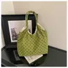 Bolso tote minimalista de lunares transfronterizo para mujer, nueva colección 2026, bolso de mano y bandolera versátil de alta gama de pana