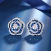 Otoño e Invierno nuevo estilo joyería Zhuang Sheng fondo de cobre chapado en oro simulación azul cristal puntiagudo Rosa temperamento traje de lujo ligero mujeres