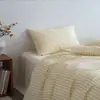 Juego de cuatro piezas de algodón puro a rayas estilo japonés, juego de sábanas y fundas de edredón 100% algodón modelo nuevo 2026, juego de tres piezas para ropa de cama de dormitorio estudiantil