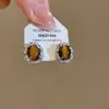 Brincos Olho de Tigre Estilo Melanoid Retro Senso de Design de Nicho Brincos Versáteis Luxo Leve Moda de Alta Qualidade Brincos de Tarraxa para Mulheres