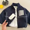 Chaqueta Lisa Infantil 2026 Otoño/Invierno Nuevo Estilo para Niños y Niñas Niños Pequeños y Medianos Cremallera Cuello Alto Tendencia Top Cárdigan de Bebé Elegante