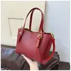 Bolso Pequeño Transfronterizo para Mujer 2026 Nuevo Diseño Retro de Nicho Bolso de Mano Tipo Cubo Bolso de Hombro Cruzado Tejido a la Moda
