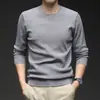 Nueva colección de otoño e invierno: Suéter Puyuan para hombre, de color liso, cuello redondo, tejido jacquard, casual y elegante, diseño simple, perfecto como capa base