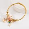 Pulsera Panjia Nuevo Estilo Distintiva de Acero Inoxidable con Perlas para Mujer Colgante de Flor de Aceite que Cae Diamante Moda Popular de Internet Pulsera para Novia