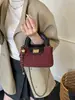Bolso cubeta de moda estilo retro para mujer, nueva colección 2025, bolso de cadena versátil con patrón de diamantes, bolso tote pequeño retro de color bloqueado con acabado mate