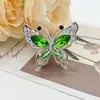 Nuevo amuleto de bolígrafo de cristal con mariposa incrustada de diamantes de doble cara de aleación, accesorio de llavero de cadena para teléfono de cuatro agujeros de alta resistencia para manualidades
