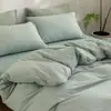 Juego de cuatro piezas de algodón 100% teñido en hilo y lavado, algodón puro, sin marca, suministrado por el fabricante, funda de edredón de alta calidad, sábana bajera de estilo japonés, ropa de cama al por mayor