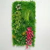 Pared de plantas artificiales, pared de césped, mampara de flores artificiales de plástico, fondo de valla con flores artificiales y plantas verdes para decoración de centros comerciales