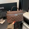 Bolso de mano pequeño tipo caja estilo Chanel con patrón de rombos 2026 Otoño nuevo elegante estiloso simple bandolera bolso pequeño de un solo hombro