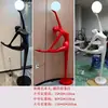 Lámpara de escultura abstracta de bola de personaje Lámpara de sala de exposiciones lámpara de oficina de ventas de hotel Lámpara de decoración artística lámpara de león lámpara de pie con forma humana