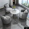 Sencillo y elegante conjunto de sofá individual y mesa de centro, adecuado para áreas de ocio, recepción de hotel, oficinas de ventas, salas de reuniones y salones de belleza.