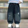 Jeans para Niños Estilo Primavera y Otoño 2026 Nuevos Elegantes Pantalones Casuales para Niños Moda Bebé Pantalones de Dibujos Animados Modernos