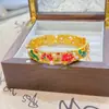 Tienda de oro con nuevo brazalete de color esmalte chino para mujer, brazalete con hebilla de estilo retro de corte, joyería hueca de seda
