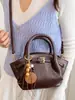 Elegante Bolsa de Cesta de Compras Portátil Xiaomi para Mujer 2026 Principios de Otoño Nueva Bolsa Tote Pequeña Plegada Nicho Bolso Cubo Bolso Cruzado