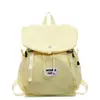 Mochila com Cordão Cor Sólida Estilo Japonês Cordão Mochila Feminina Verão 2025 Simples Leve Casual Roupas de Trabalho Pequena Mochila para Exterior