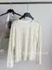 Camiseta de manga larga texturizada y ligera para mujer, nueva colección primavera 2026, top único y elegante, cubierta transpirable y protectora del sol