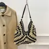 Bolsa tejida popular de celebridad de internet de gran capacidad para mujer 2026 Verano Nuevo Bolso de hombro único de paja Informal Bolso de playa para el mar