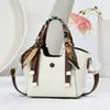 Bolso cubo de cuero brillante de alta gama, gran capacidad, nuevo y elegante, versátil para llevar al hombro, cruzado, de mano, bolso tote para mujer