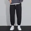 Calça Esportiva Cinza Masculina Primavera e Outono Perna Larga Calça Harem Moda Coreana Calça de Moletom Forrada com Lã Casual Comprimento no Tornozelo