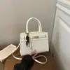 Bolsa elegante e minimalista de PU trançado para mulheres, nova coleção 2026, bolsa de ombro, bolsa transversal, adequada para o trajeto diário e negócios, bolsa quadrada pequena, bolsa de mão