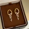 Brincos Redondos com Borla e Diamantes Incrustados em Agulha de Prata, Brincos Modernos, Requintados e Versáteis, Nicho de Luxo Leve, Atacado de Brincos de Alta Qualidade para Mulheres