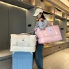 Nueva bolsa de viaje portátil para mujer, venta al por mayor transfronteriza, bolsa de natación y fitness con separación de humedad y secado seco para negocios de corta distancia, bolsa de almacenamiento cruzada.