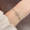 Pulseras de hilo con mariposa de circonita cúbica, exquisitas y a la moda, de estilo japonés y coreano, que exudan un ambiente elegante, lujoso y versátil, con un aspecto de alta gama y deslumbrante - disponibles al por mayor