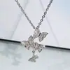 Colar feminino curto de quatro borboletas estilo coreano da moda Corrente de clavícula de diamante moda estilo doce conjunto de joias de três peças
