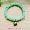 Puestos de lugares escénicos que venden joyas productos de bienestar en vivo cuentas de barril de jade blanco imitación pulsera de valientes de oro candado de longevidad pulsera de vidrio