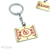Llavero colgante de aleación de metal con diseño de mariposa Zhilang You Bean de Anime Ghost Extermination Blade que rodea el carbón. Comercio exterior.