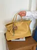 Bolso de mano casual de gran capacidad para mujer, nuevo modelo 2026, bolso de hombro simple para el día a día, bolso cruzado casual estilo coreano