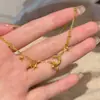 Nuevo modelo de la joyería: Collar Galaxia Dorado Arena "Oda al Oro Fluido a la Luna", collar de doble capa con borla de luna creciente y estrella, diseño de nicho