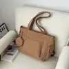 Bolso de hombro versátil de color liso, nuevo para el otoño de 2026, bolso tote de gran capacidad, bolso cruzado para estudiante y para el día a día, transfronterizo