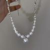 Collar de plata rota con perla estilo francés para mujer, ligero, lujoso, de alta gama, elegante, estilo frío, cadena de clavícula distintiva que combina con todo.